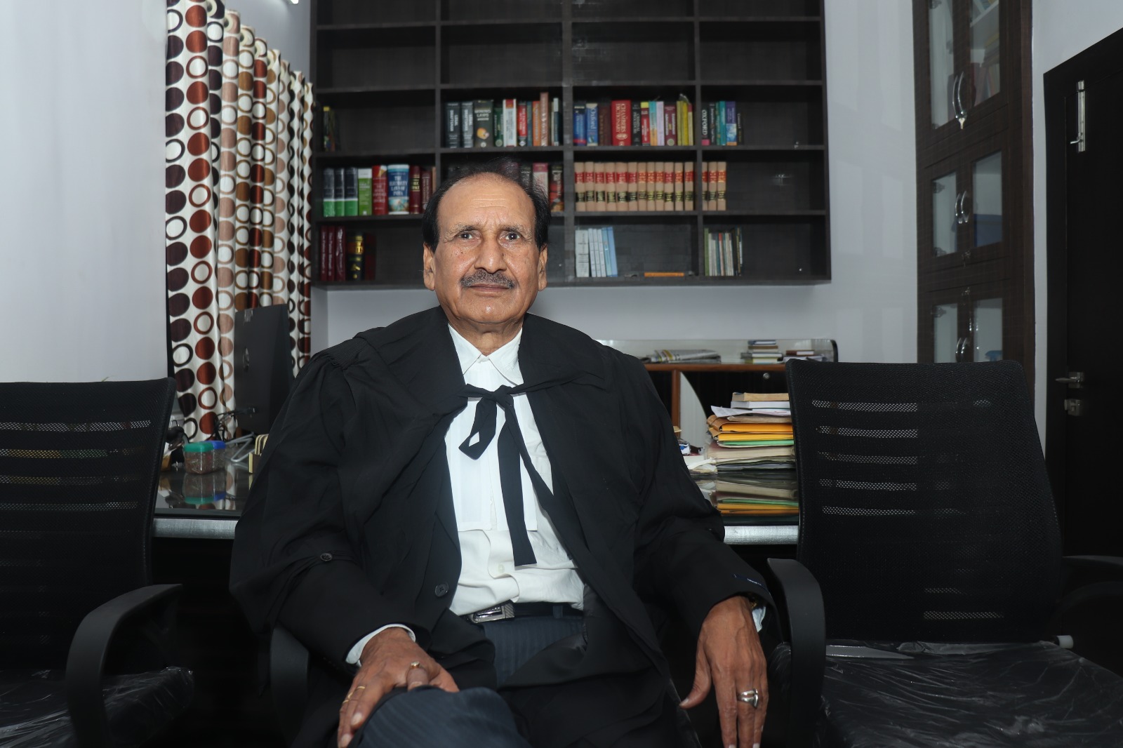 Advocate Choubey in his chamber with legal books